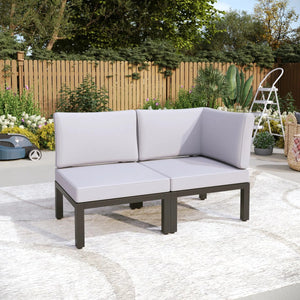 Corner garden sofa arranged in a compact patio corner