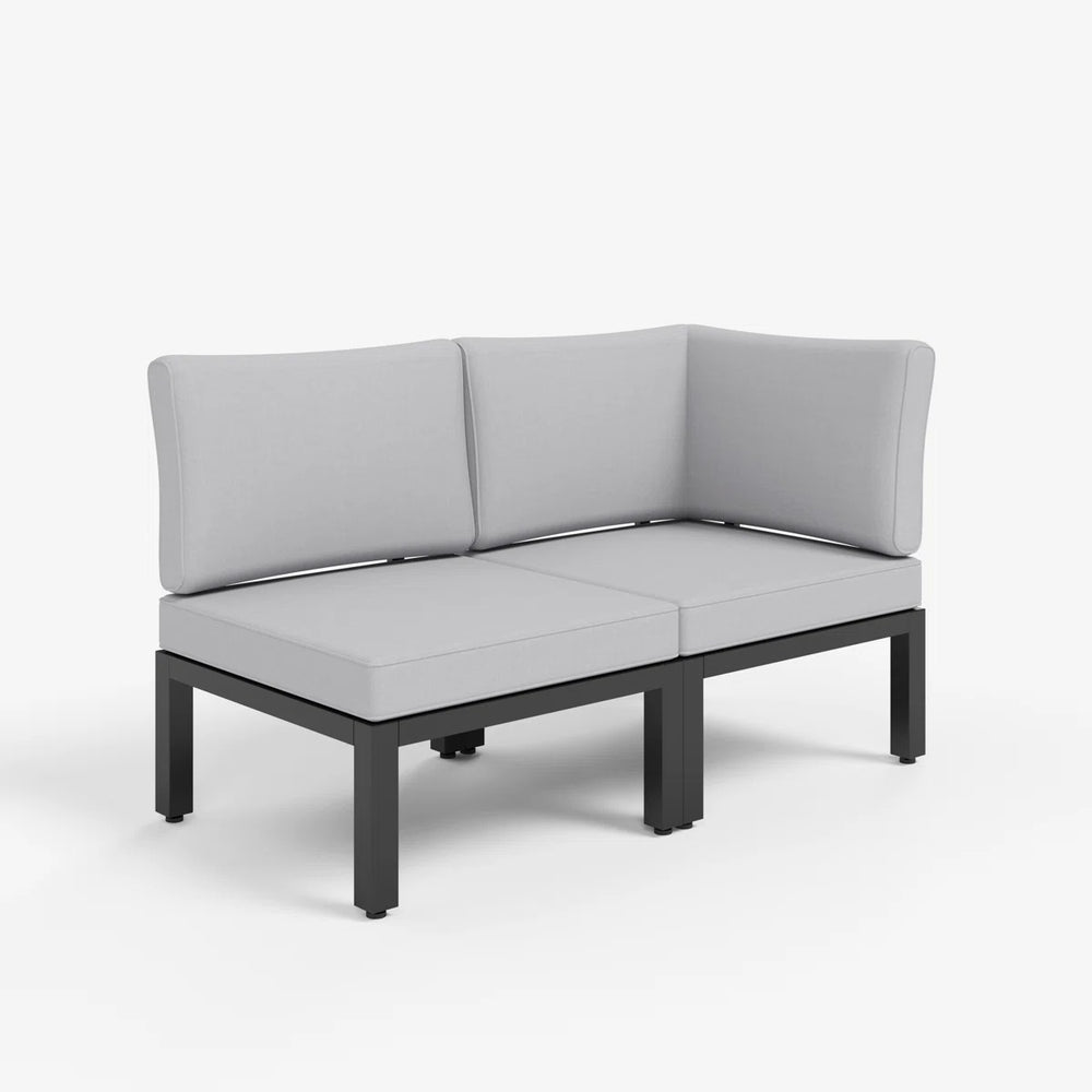 Corner garden sofa arranged in a compact patio corner