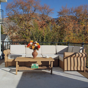Classic triple-strand rattan garden sofa with iron frame, padded cushions & dual-tier side table
